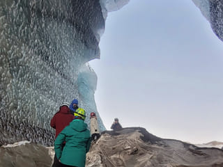 People inside an ice cave.