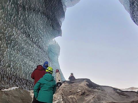 People inside an ice cave.