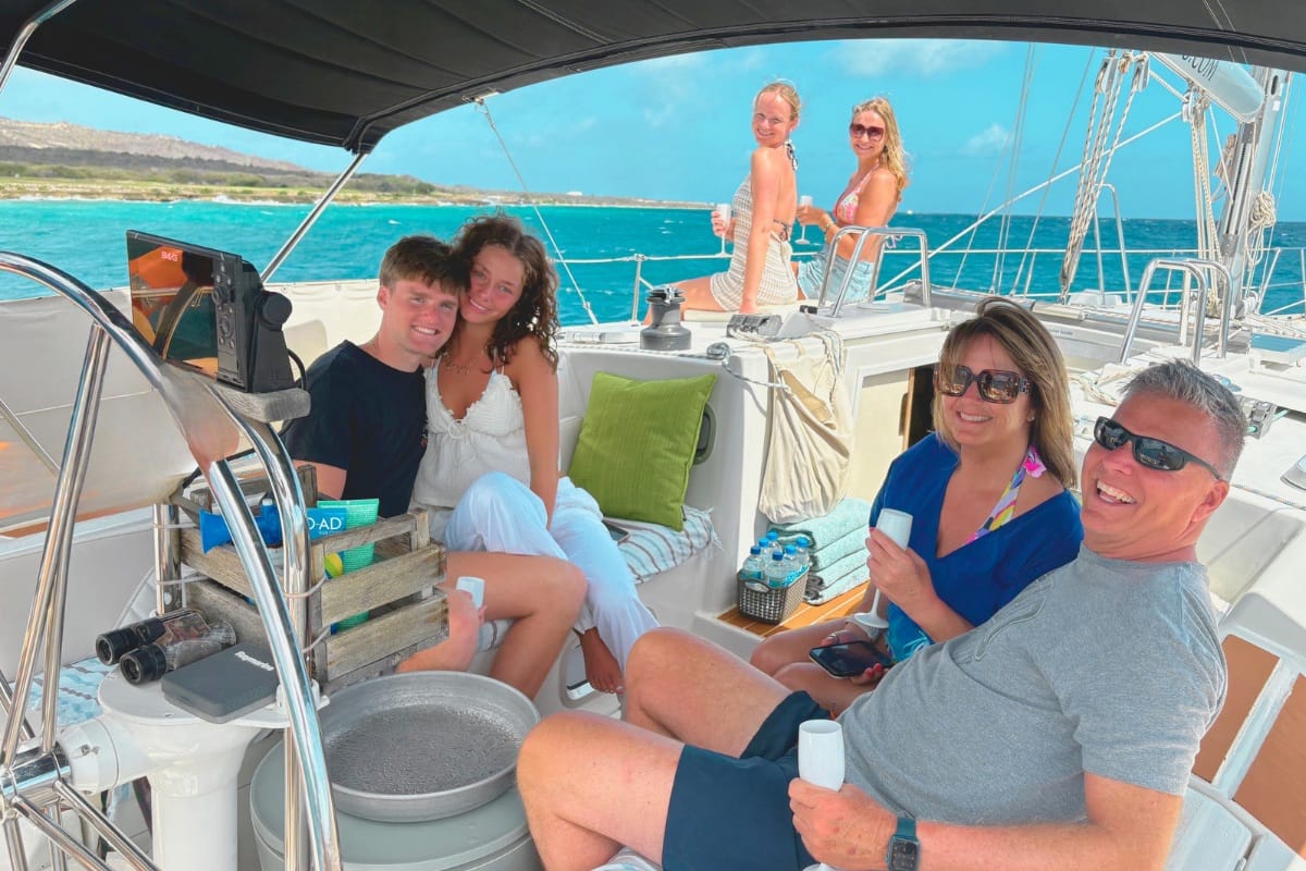 Family enjoying sailing Caribbean Sea during a sunset sail in Curacao