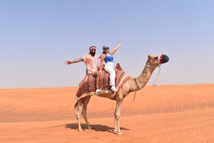Exclusive Desert Safari Camel Ride Sandboard & Buffet BBQ Dinner