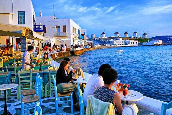 Little Venice in Mykonos with a view to the famous windmills