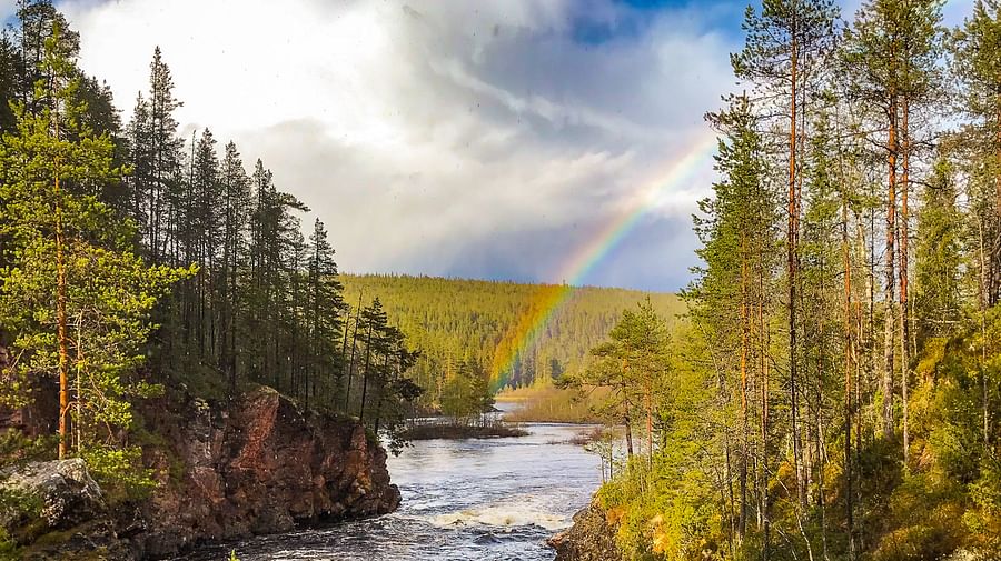 Rainbow over the river in Lapland
