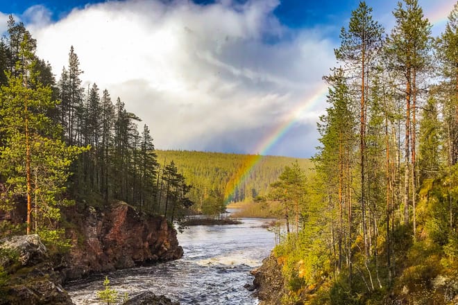 Rainbow over the river in Lapland