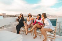 Toast your Cabo vacation with premium drinks and stunning sunset views aboard your private luxury yacht adventure!
