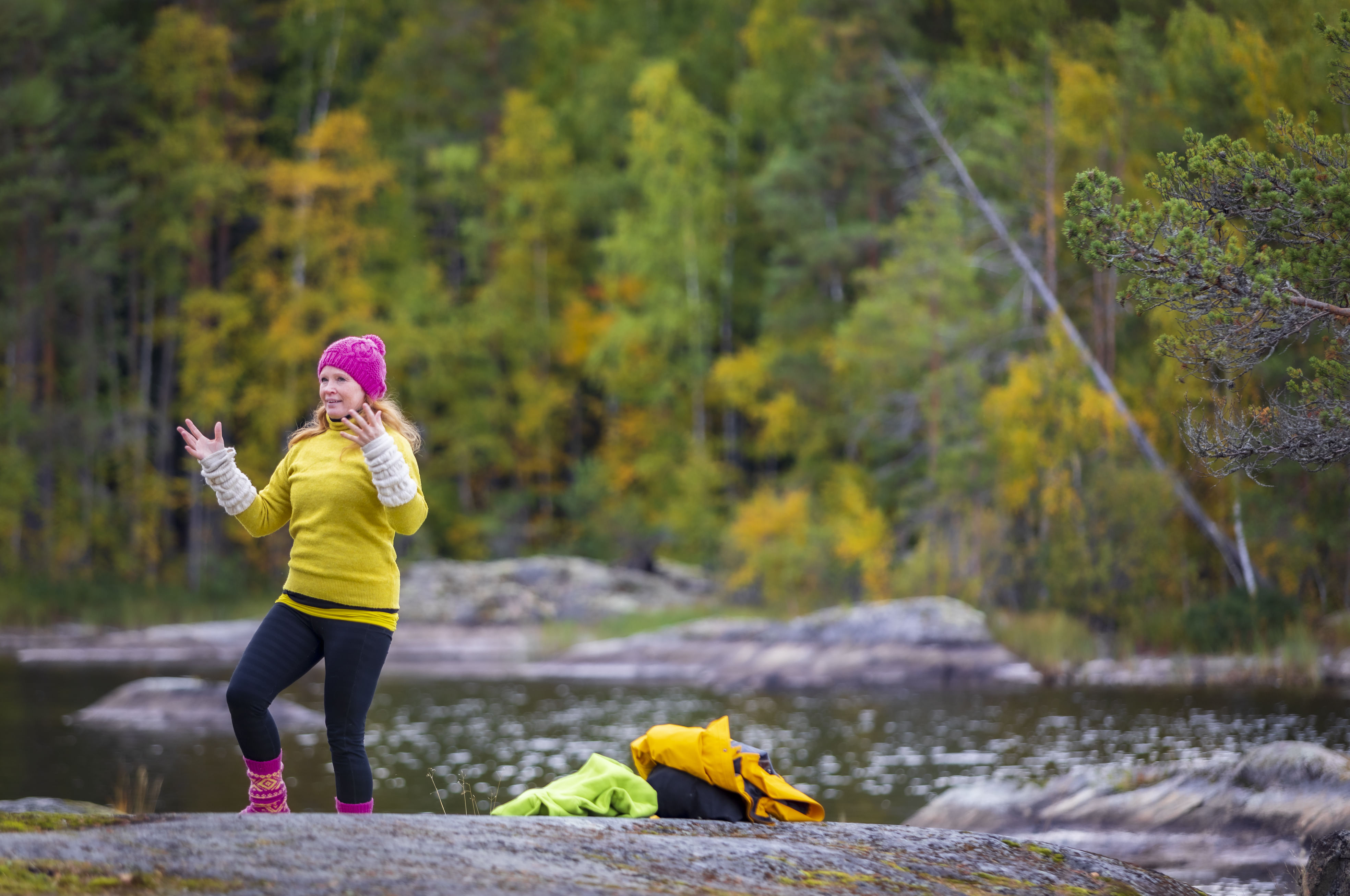 A woman exercising yoga outdoors