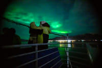 Green aurora waves moving across the dark Icelandic sky