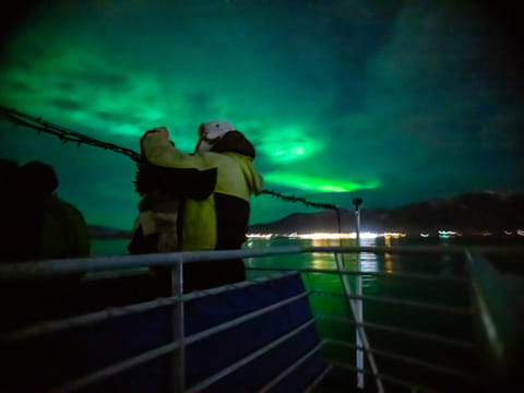 Green aurora waves moving across the dark Icelandic sky