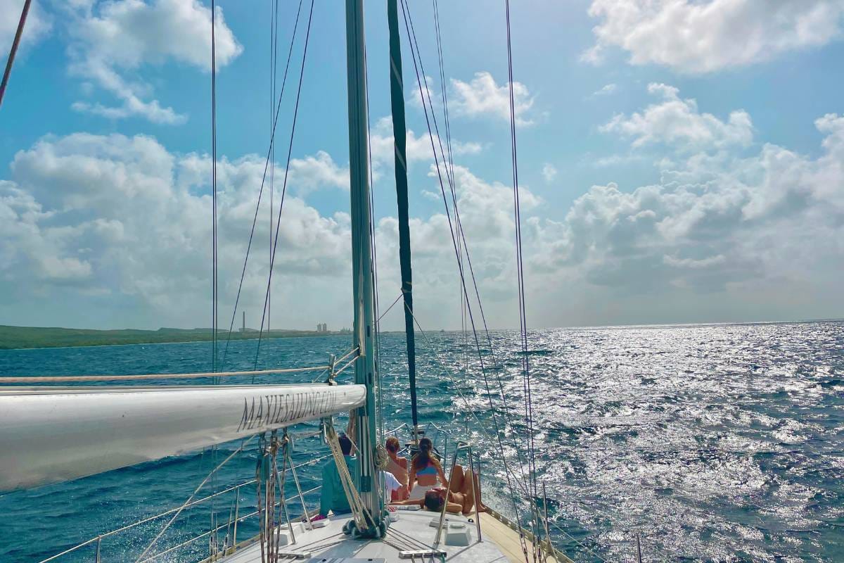 Family enjoying sailing Caribbean Sea during morning tour by Maxie Sailing in Curacao