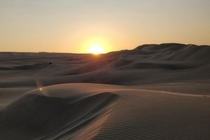 Private sunrise desert safari bashing\camel ride\sand boarding\Inland sea visit.