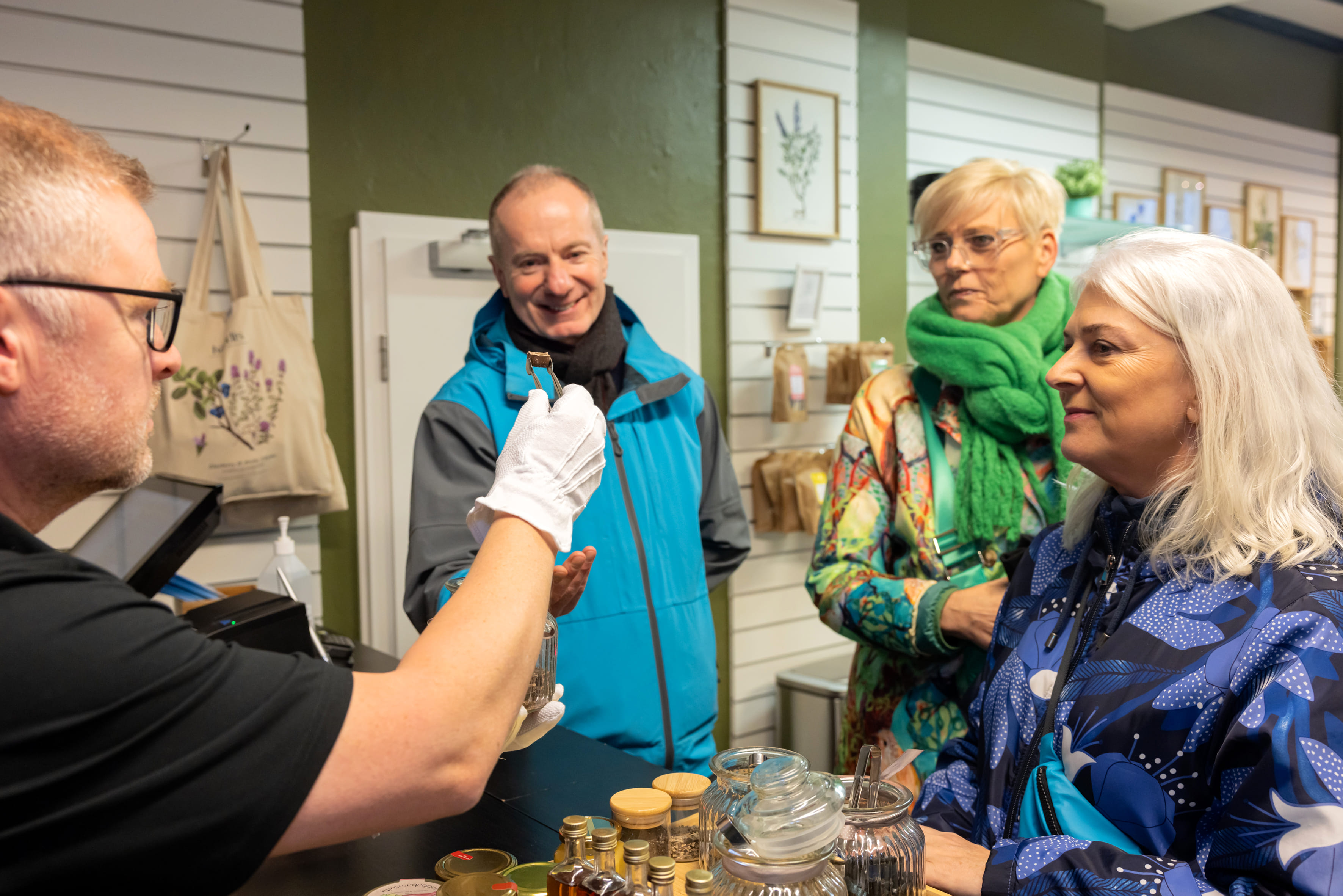 Travellers tasting different samples of Icelandic sweets.