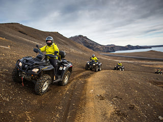 ATVs driving up a mountain side