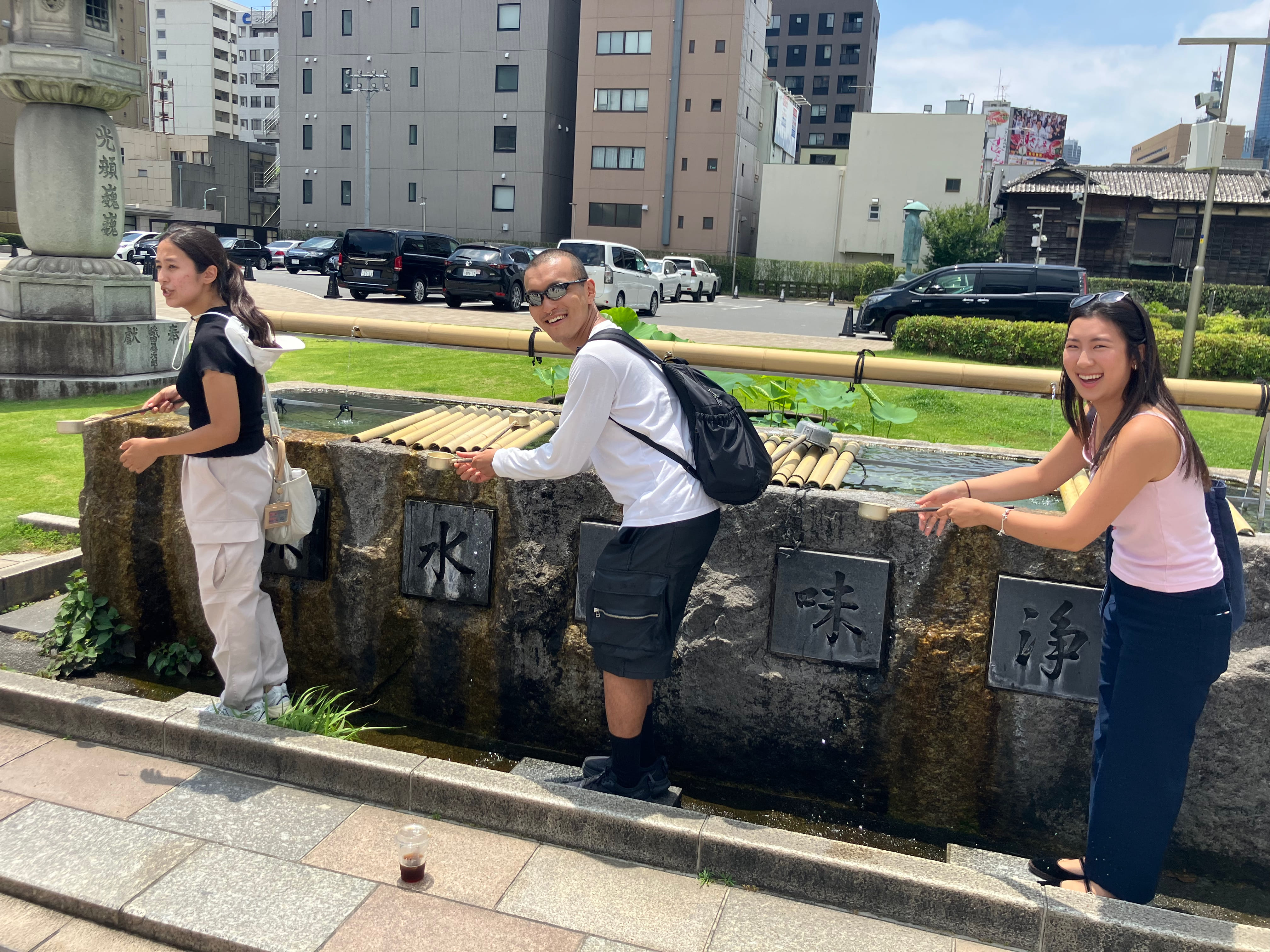Guests purifying themselves outside Tsukiji Hongwanji temple