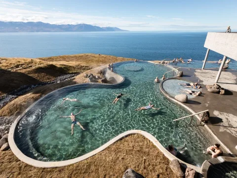 Wide shot of GeoSea Baths pools with cliffside ocean views