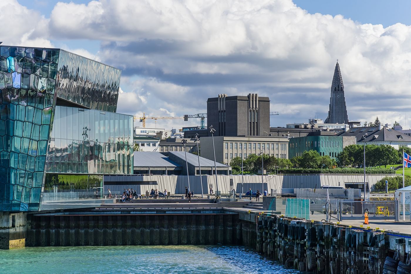 A picture of the Harpa Concert Hall with Downtown Reykjavik in the background