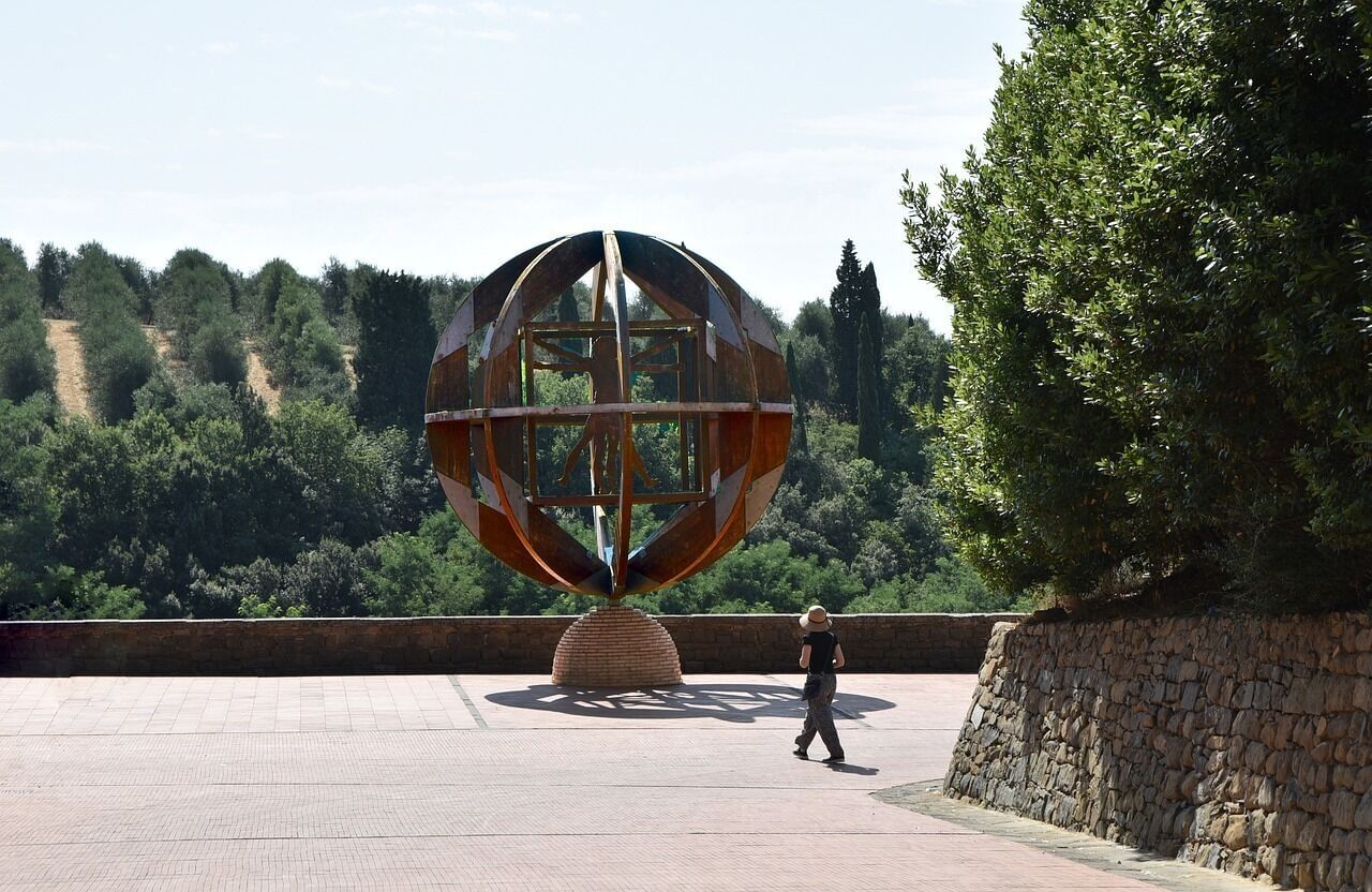 View of a sculpture depicting the Vitruvian man encircled in a sphere in Vinci 