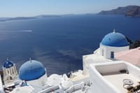 Iconic blue domes and breathtaking caldera views - the Santorini you came to see, captured at the perfect spot.