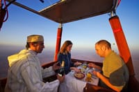 Discover the magic of Marrakech from above with a hot air balloon ride, complete with a meal served in the sky. Enjoy panoramic vistas and a truly unique culinary experience.