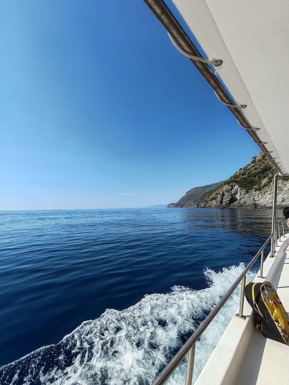 Sailboat in the Strait of Messina near Capo Peloro
