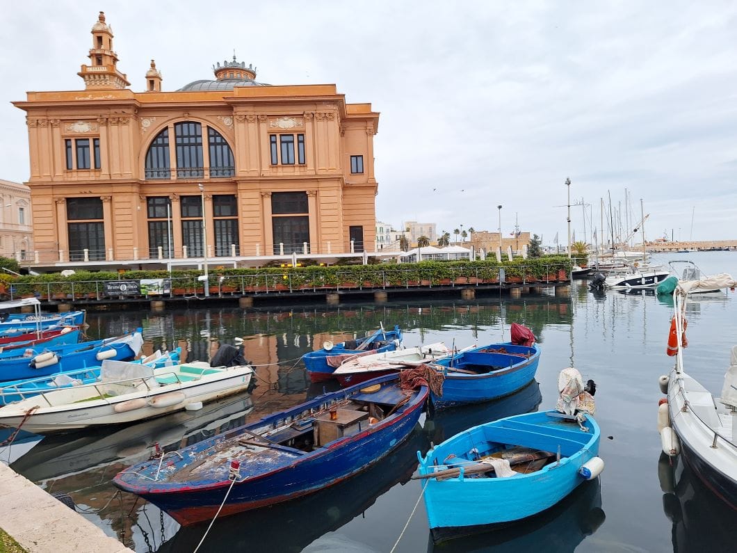Small harbor in Bari Old Town with traditional fishing boats and coastal view