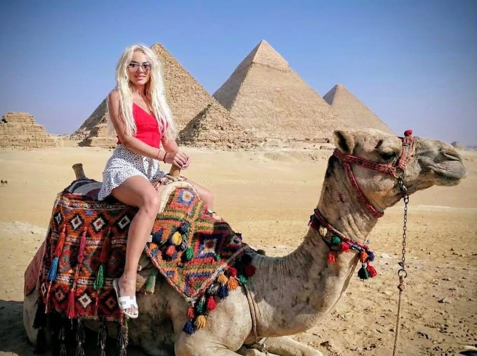 Visitors experiencing private camel rides on Egypt luxury holidays.