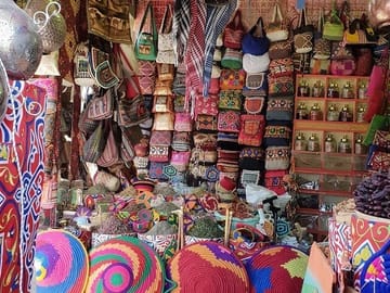 "Aswan Essence: Spiritual Sites, Sunset Cafe & Bazaar Adventure"