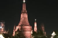 Passing Wat Arun under lights