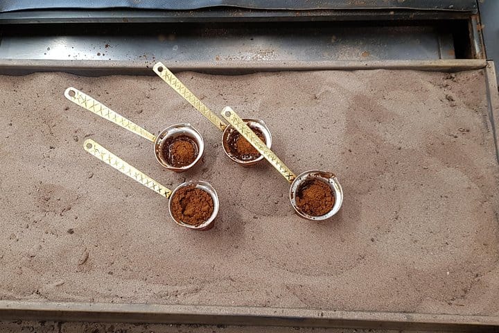 Traditional boiled coffee in the hot sand