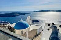 The most iconic view in Fira — blue dome, bell tower, and endless sea. A timeless scene that captures the spirit of Santorini in a single glance.