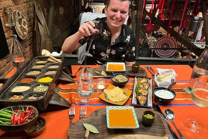 Private dining room decorated with African artefacts and colourful linens at Gold Restaurant, Cape Town.