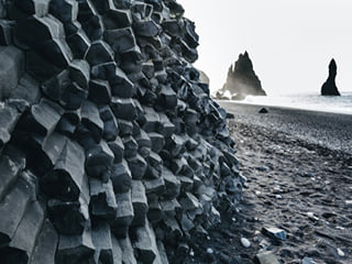 A picture of rock formations by Reynisfjara, the Black Beach.