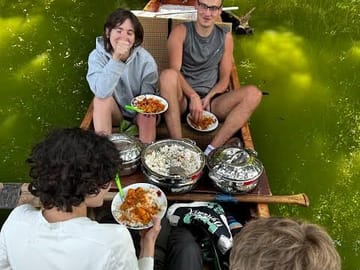 Enjoying a unique floating picnic lunch on Lake Duluti.
