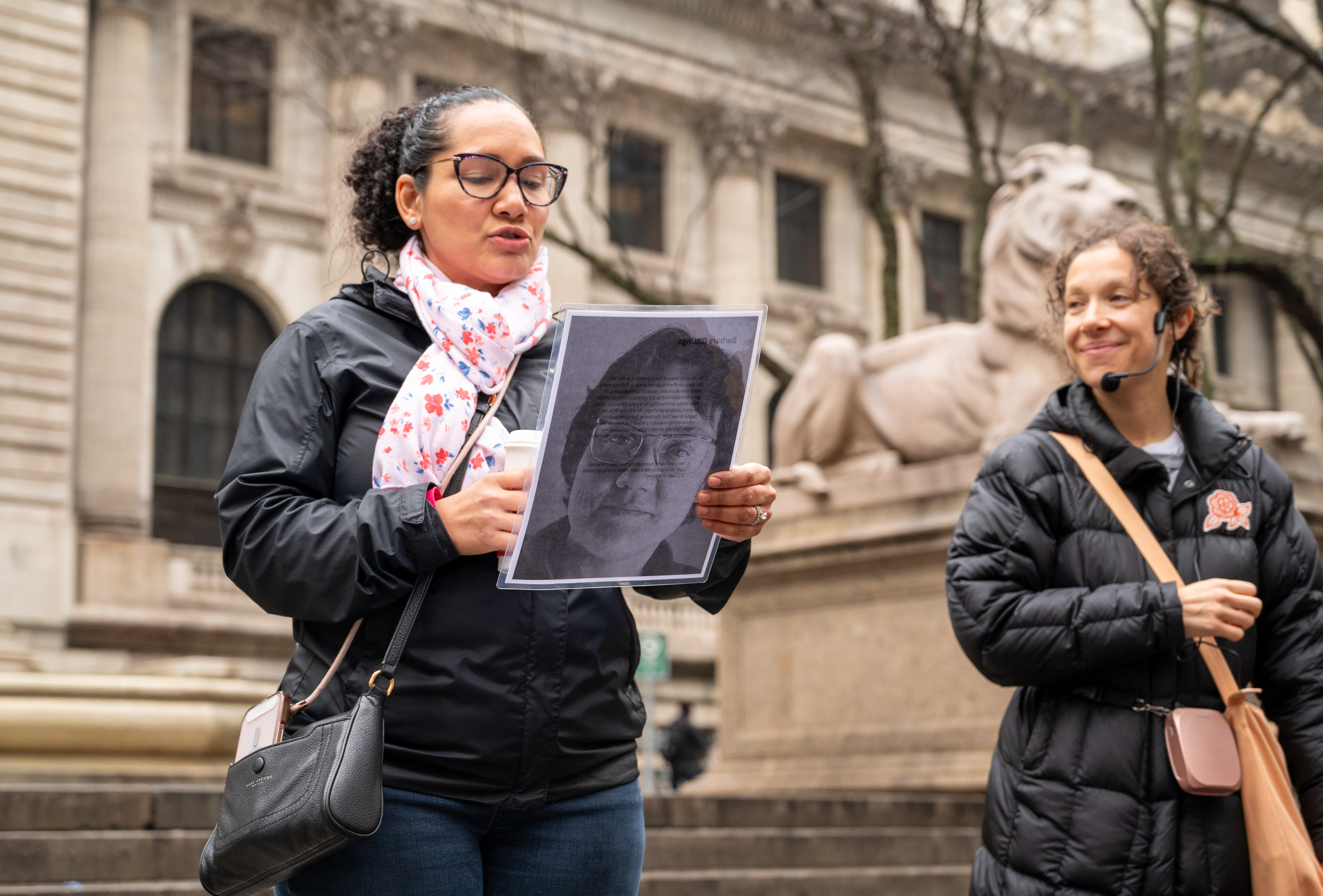 At the steps of the NYPL, a guest represents Barbara Gittings.