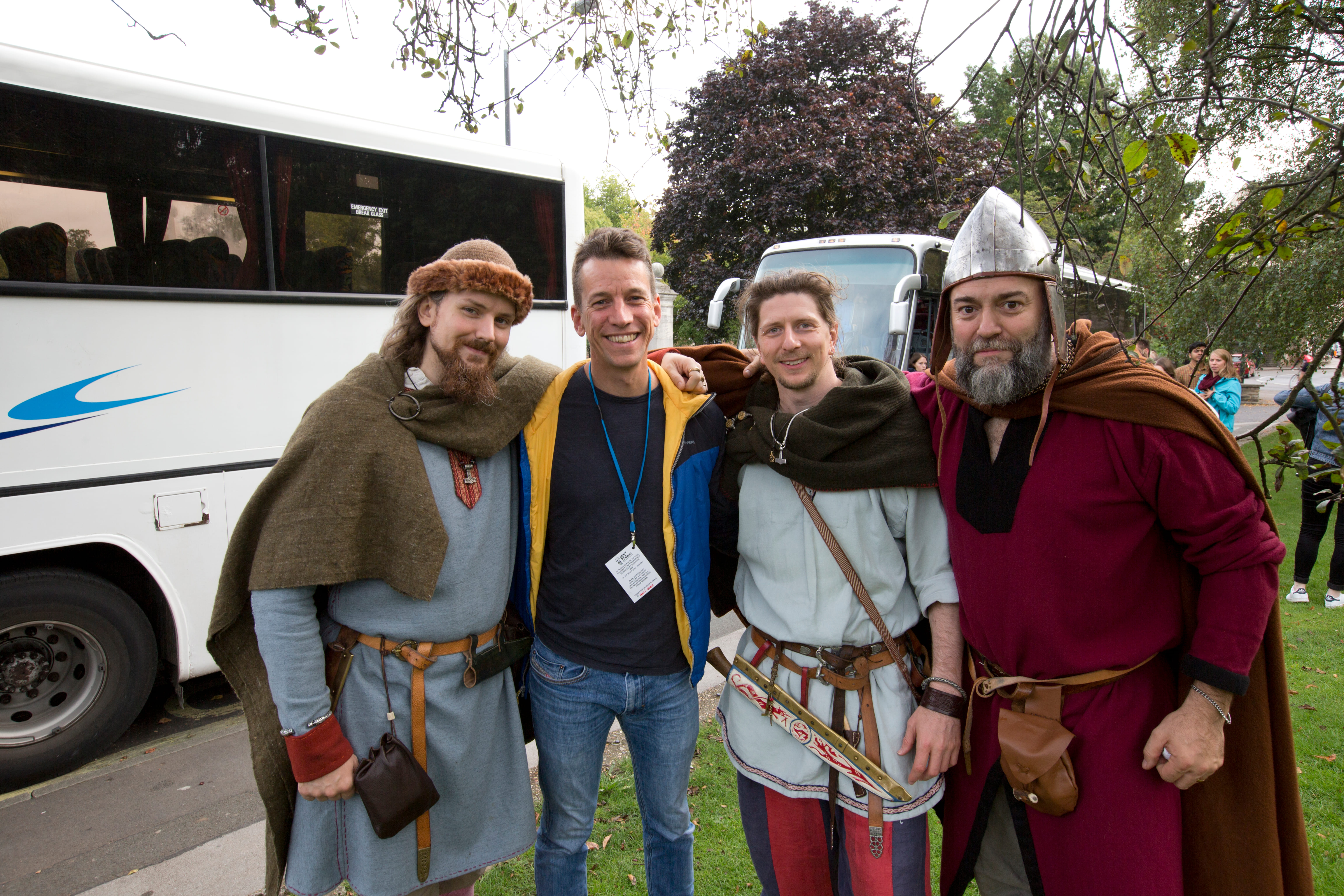 Three Viking guides posing with a Leeds-based tour operator for international students.