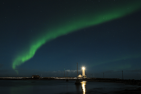 Northern lights over an Icelandic lighthouse