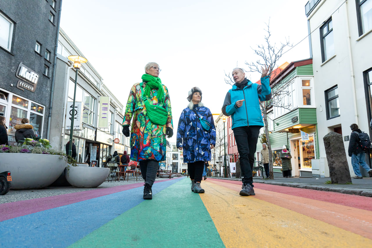 A group of guests enjoying the cozy atmosphere of Reykjavik while listening to our Guide 