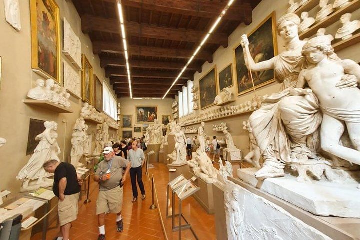 Internal hall of the Accademia Gallery with paintings and sculptures on dispaly