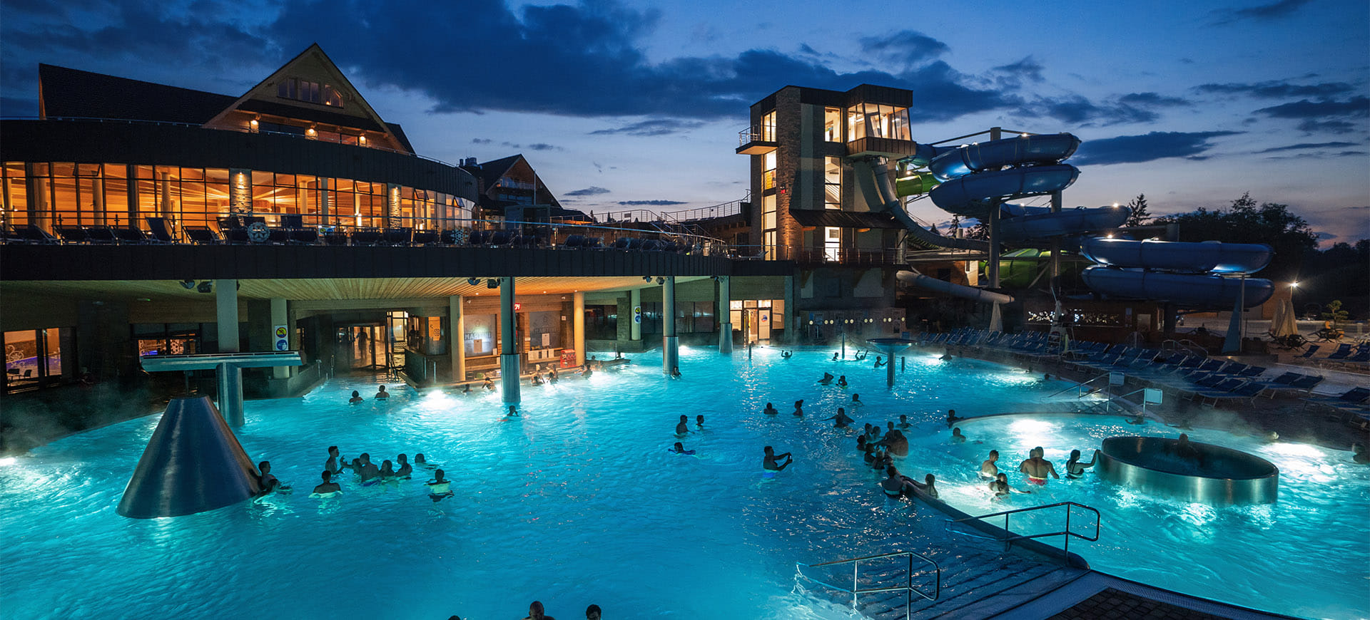 Chochołów Thermal Baths winter aerial view at night — outdoor pools and Tatra Mountains Podhale Poland