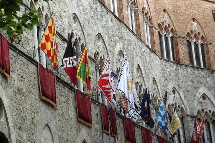 View of the flags that represent the districts that participate in the famous Palio di Siena