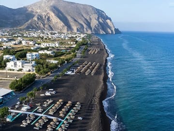 Perivolos & Perissa Perivolos beach in Santorini is the longest black beach in Santorini. It is located near Perissa (3 km away), lying on the southern end of the island, 10 km south of Fira.