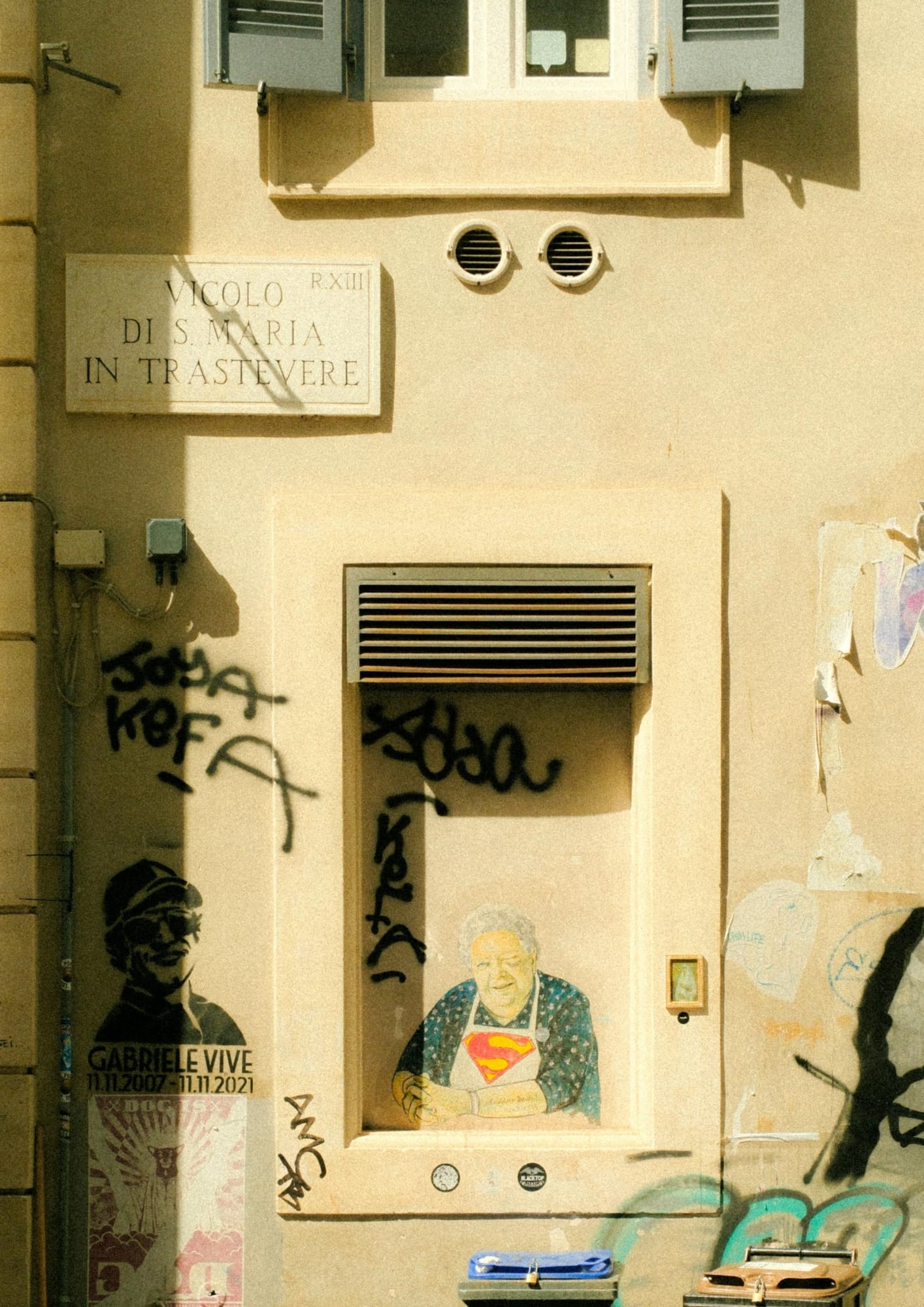Trastevere in one frame—golden light, tight geometry, and the city’s rough poetry on the walls.
