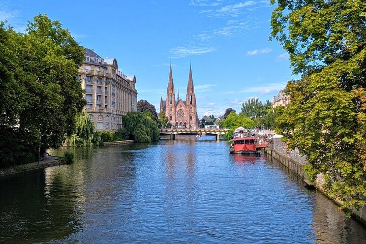 Saint Paul's Church, with its two 76-meter twin spires, standing over the Ill River.
