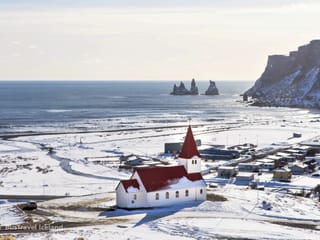View over Vík village and Reynisdrangar Sea Stacks