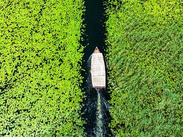 Relax on a traditional wooden boat while exploring Lake Skadar’s untouched natural wonders.
