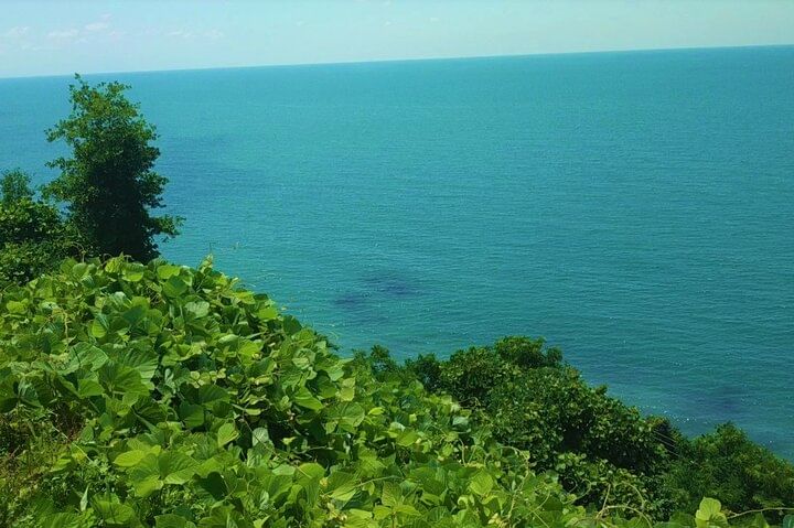 Black sea and green cape
