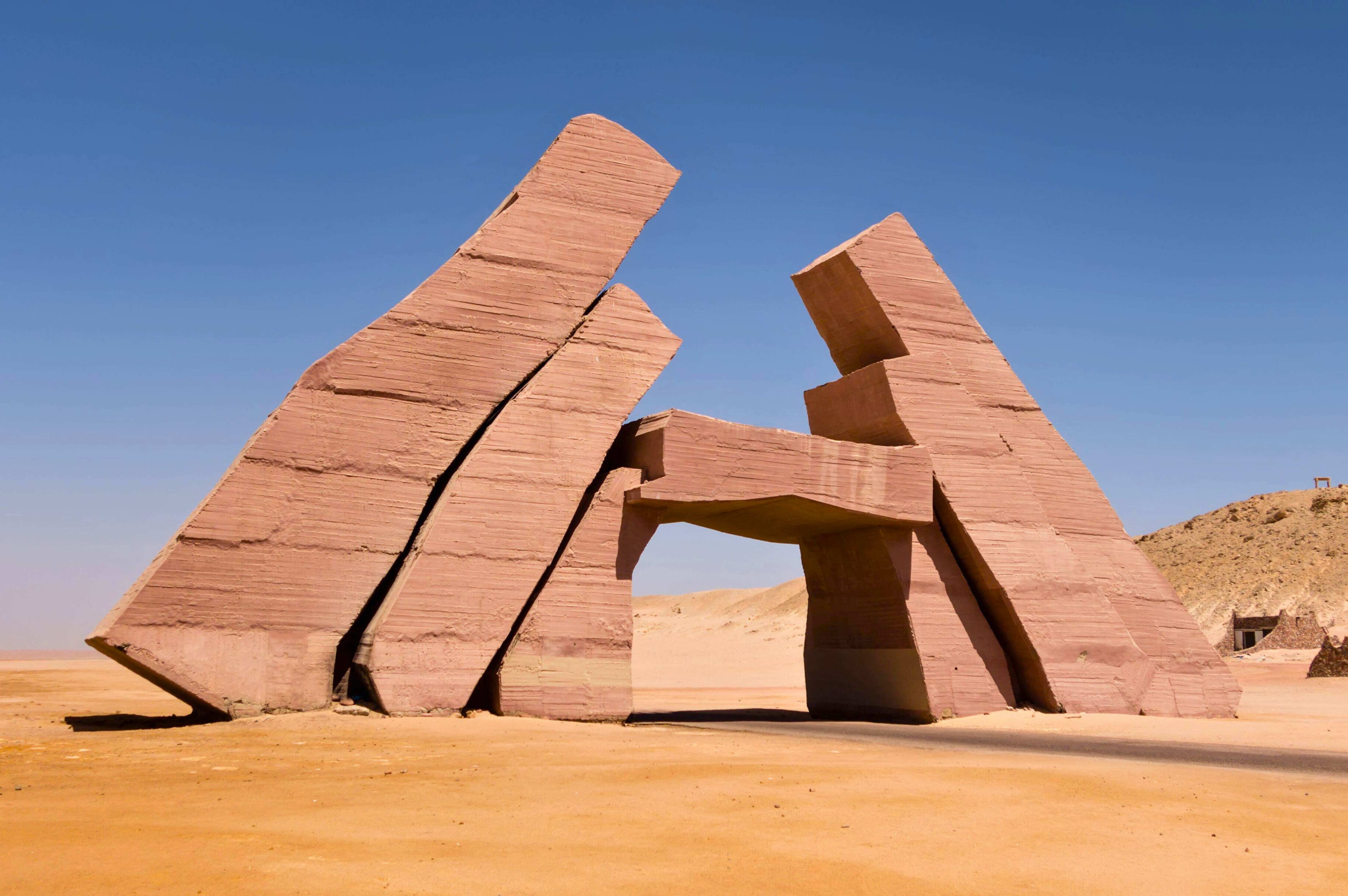 The iconic, large, stacked stone structure known as the Allah Gate or Ras Mohammed entrance.