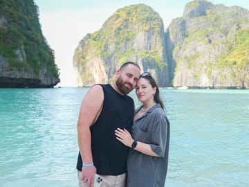 Couple standing on Maya Bay beach during Phi Phi Islands speedboat tour