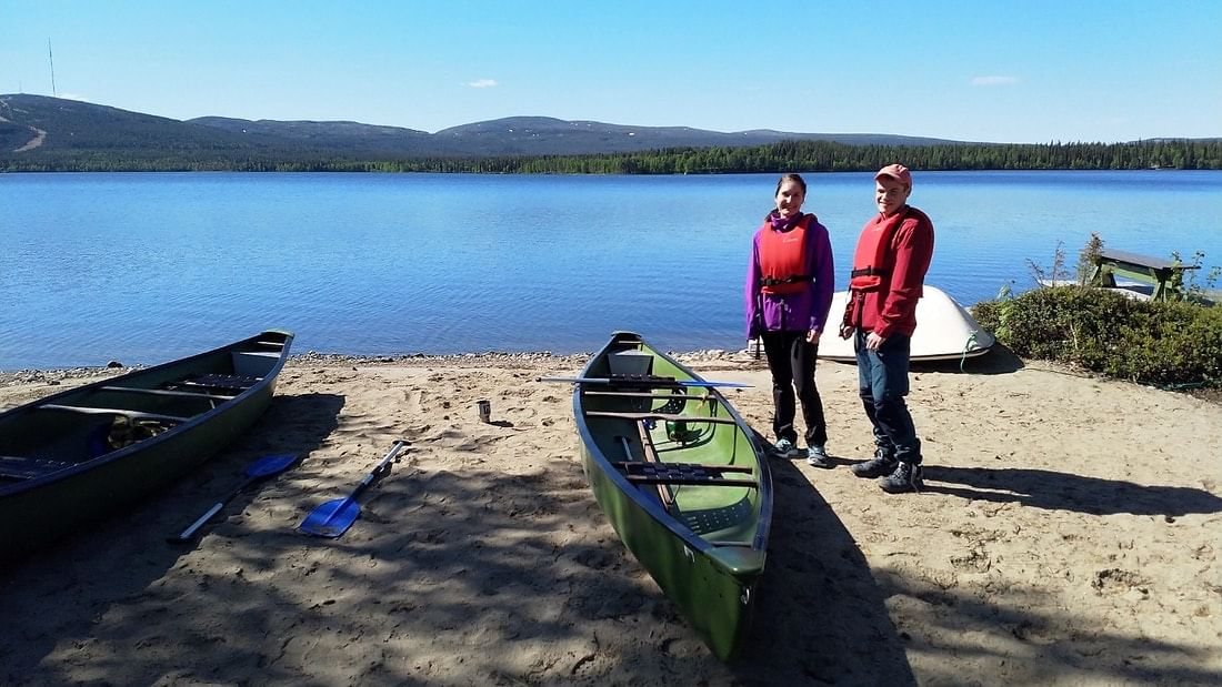 About to leave for a paddling trip two sharing a canoe.
