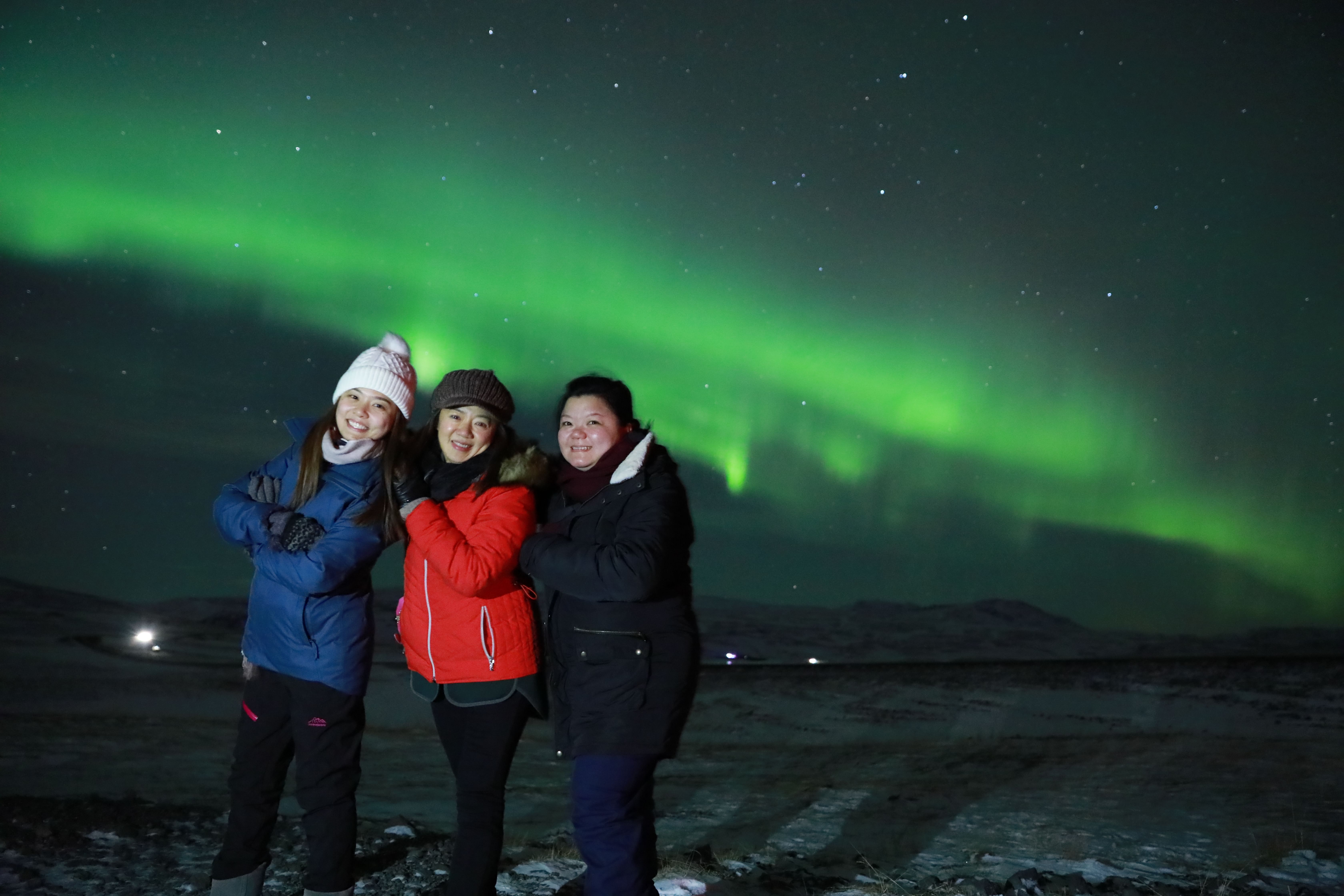 Family enjoying the Northern Lights Iceland