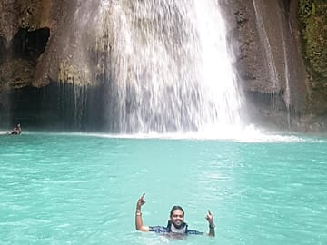 And when it's all over, strike a pose at Kawasan Falls - your ultimate reward after an awesome day