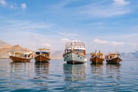 Your adventure starts aboard a traditional Omani Dhow, navigating the breathtaking fjords of Musandam Khasab. Spend the day cruising, swimming, and searching for dolphins before your Overnight stay an